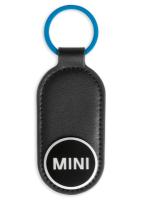 Кожаный брелок с эмалированным логотипом MINI Wordmark Enamel Keyring, Black/Island/White, артикул 80275A21236 Кожаный брелок с эмалированным логотипом MINI Wordmark Enamel Keyring, Black/Island/White, артикул 80275A21236